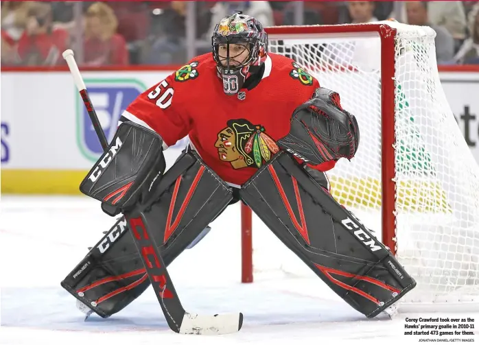  ?? JONATHAN DANIEL/ GETTY IMAGES ?? Corey Crawford took over as the Hawks’ primary goalie in 2010- 11 and started 473 games for them.