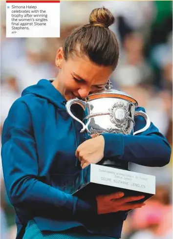  ?? AFP ?? Simona Halep celebrates with the trophy after winning the women’s singles final against Sloane Stephens.