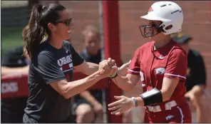  ?? NWA Democrat-Gazette/ANDY SHUPE ?? Arkansas shortstop A.J. Belans (right) is congratula­ted by Coach Courtney Deifel after hitting a home run in the fifth inning Saturday during the Razorbacks’ 5-0 victory over Wichita State at Bogle Park in Fayettevil­le. Belans finished 2 for 3 with 1 RBI and 1 run scored.