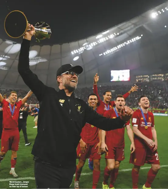  ??  ?? World beaters...Jurgen Klopp leads Liverpool on their lap of honour