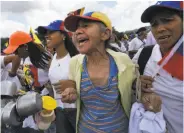  ?? Ariana Cubillos / Associated Press ?? Protesters in Caracas demand a recall referendum against Venezuelan President Nicolas Maduro.