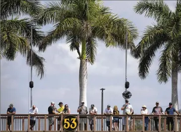  ?? BRYNN ANDERSON/AP ?? Fans watch the Orioles play the Pirates last month in spring training in Bradenton, Florida. Some fans like the idea of being in and out of a game in under three hours, about how long an average nine-inning game lasted in 2022.