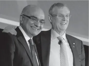  ?? ADRIAN WYLD/THE CANADIAN PRESS ?? TD Bank CEO Ed Clark, right, who announced his retirement this week, stands with Bharat Masrani at the company’s annual general meeting Thursday in Ottawa. Masrani will take over as TD’s CEO in November 2014.