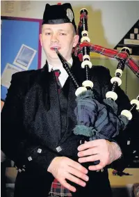  ??  ?? ●●Ian Crossley played the pipes at St Thomas’ Primary School Burns night dance