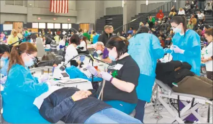  ?? Contribute­d photo / Mission of Mercy ?? Above, patients are treated by volunteers during a previous Mission of Mercy dental clinic. This year’s free dental outreach will be held at Torrington High School on Friday and Saturday.