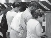  ??  ?? Voters cast their ballots.