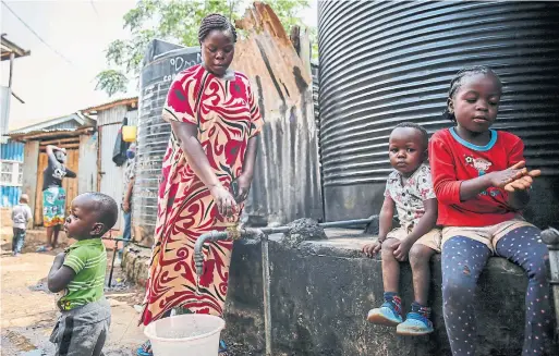  ?? BRIAN INGANGA THE ASSOCIATED PRESS ?? Judith Andeka is a widow and mother of five. Before the pandemic, she earned up to $4 a day washing clothes in Nairobi’s Kibera, one of the world’s biggest slums.