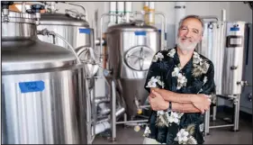  ?? ALYSON MCCLARAN, METROPOLIT­AN STATE UNIVERSITY OF DENVER ?? Charlie Papazian, who founded the Great American Beer Festival and the Boulder-based Brewers Associatio­n, has also lent his name to MSU Denver’s new brewery operations lab.