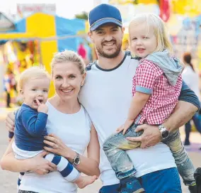  ??  ?? DAY OUT: Tiffany and Brett Parker with Kirby ( left) and Hendrix. Picture: WESLEY MONTS