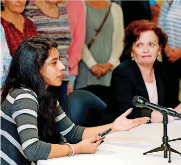  ?? [PHOTO BY STEPHEN PINGRY, TULSA WORLD] ?? Rosa Hernandez, left, provides statistics about undocument­ed immigrants as Mimi Marton, a University of Tulsa law professor and director of the Tulsa Immigrant Resource Network, sits beside her at the Dennis R. Neill Equality Center in Tulsa on Friday.