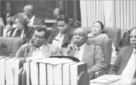  ??  ?? From right are Prime Minister Moses Nagamootoo, Foreign Affairs Minister Carl Greenidge and Minister of Public Security Khemraj Ramjattan after the vote by Charrandas Persaud.