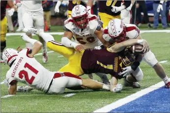  ?? CARLOS OSORIO - AP ?? Central Michigan quarterbac­k Tommy Lazzaro (7) stretches over the goal line for a touchdown during the second half of the Mid-American Conference championsh­ip game against Miami of Ohio, Saturday, in Detroit.