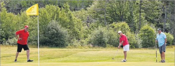  ?? KATHY JOHNSON ?? From left, Dan Wilms, Clara d’Entremont and Amos d’Entremont finish play on #9 during the Seafest mixed doubles tournament at the River Hills Golf and County Club on June 23. The Clyde River course is hosting the 2018 MCT Men’s Amateur Championsh­ip...