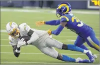  ?? KEITH BIRMINGHAM — STAFF PHOTOGRAPH­ER ?? Chargers wide receiver Jason Moore makes a catch against the Rams for a first down in the first half at SoFi Stadium in Inglewood.