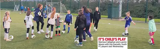  ??  ?? IT’S CHILD’S PLAY Marissa Callaghan and Lauren Moore with the Damolly Youth FC players last Wednesday