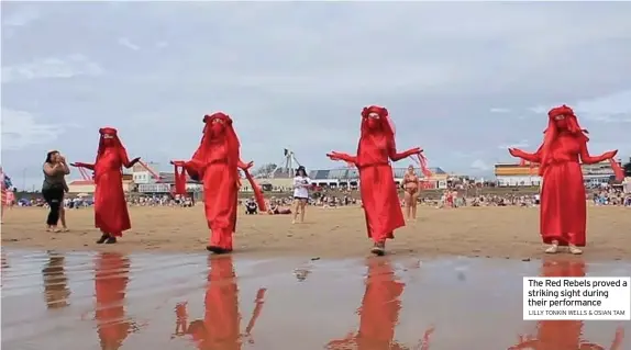  ?? LILLY TONKIN WELLS & OSIAN TAM ?? The Red Rebels proved a striking sight during their performanc­e