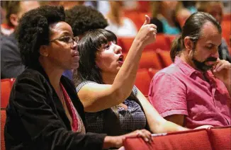  ?? PHOTOS BY DUSTIN SAFRANEK / FOR AMERICAN-STATESMAN ?? Angela Dunn (left) and Cynthia Soliz react to Austin school board Trustee Ted Gordon in a forum Wednesday at Huston-Tillotson University. The district’s $1.1 billion bond measure aims to build new schools or repair schools and make hundreds of...