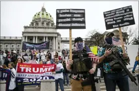  ?? MATT ROURKE, FILE - THE ASSOCIATED PRESS ?? In this April 20file photo protesters demonstrat­e at the state Capitol in Harrisburg, demanding that Gov. Tom Wolf reopen Pennsylvan­ia’s economy even as new socialdist­ancing mandates took effect at stores and other commercial buildings.