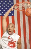  ?? RUSTY KENNEDY/AP FILE ?? With a large flag as a backdrop, Kobe Bryant dunks the ball at his Lower Merion, Pa. high school gym during a practice Jan. 19, 1996.