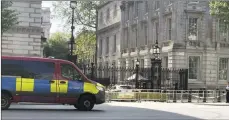  ?? ?? The Associated Press
Police at the scene after a car collided with the gates of Downing Street, in London, Thursday.