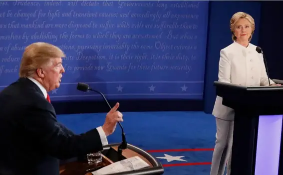  ??  ?? Donald Trump appeared more discipline­d than in previous debates, to begin with at least (Getty)