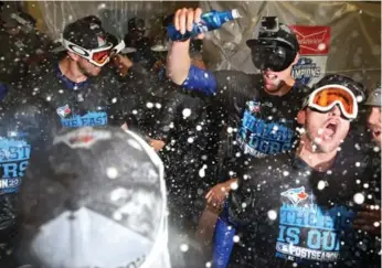  ?? PATRICK SMITH/GETTY IMAGES FILE PHOTO ?? The Blue Jays, seen here after clinching the AL East, will be battling the Yankees to repeat as division champs.