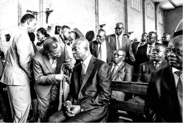  ?? — AFP photo ?? Official DR Congo Presidenti­al candidate, Emmanuel Ramazani Shadary (centre) speaks inside the Cathedral Notre-Dame Du Congo in Kinshasa during the launch of his official electoral campaign.