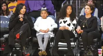  ?? ASSOCIATED PRESS FILES ?? Vanessa Bryant (from left), her daughters Gianna Bryant, Natalia Bryant and Vanessa’s mother Sofia Laine attend a 2015 Los Angeles Lakers game.