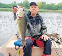  ?? FPD OF WILL COUNTY ?? Rick Dahlman, of Mokena, won the award for biggest bass in the 2021 Big Fish Contest held by the Forest Preserve District of Will County at the Monee Reservoir for this 21.5-inch catch.