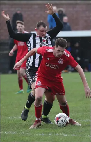  ??  ?? Glenafton’s Kyle McAusland battles with David Gormley of Pollok on Saturday. Picture: Stewart Attwood.