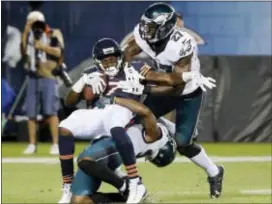  ?? THE ASSOCIATED PRESS FILE ?? Eagles free safety Jalen Mills, right, joins a tackle with teammate Malcolm Jenkins against then-Chicago Bears wide receiver Alshon Jeffery in a Monday Night Football game last September. Mills is hoping to be part of better days for the Eagles’...