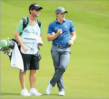  ??  ?? Wicklow’s Paul Dunne looks down the 4th hole with caddie Darren Reynolds during day four of the BMW PGA Championsh­ip at Wentworth.