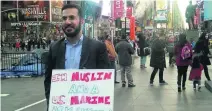  ?? Rob Crilly / The National ?? Mansoor Shams, a Muslim and former US marine, in Times Square in New York with his ‘ask anything’ campaign.