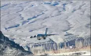  ?? ANI ?? EYEBALL TO EYEBALL WITH CHINA: Indian Air Force C-17 Globemaste­r aircraft seen flying in Ladakh in this 4 December photo.