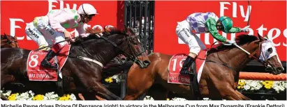  ??  ?? Michelle Payne drives Prince Of Penzance (right) to victory in the Melbourne Cup from Max Dynamite (Frankie Dettori)