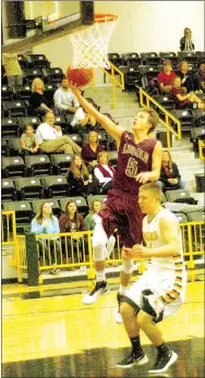  ?? MARK HUMPHREY ENTERPRISE-LEADER ?? Lincoln guard Bryce Means scores a layup after stealing the ball and beating Prairie Grove’s Zeke Laird to the hoop. The Tigers beat the Wolves Jan. 11, but a few weeks later Lincoln evened the season series with an improbable, 53-52, comeback win at home. Means accepted a basketball scholarshi­p from Bacone College of Muskogee, Okla., June 1.