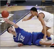  ?? AJ MAST — THE ASSOCIATED PRESS ?? Creighton center Ryan Kalkbrenne­r, left, and Gonzaga guard Jalen Suggs chase a loose ball in the second half of Sunday’s game.
