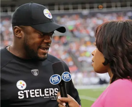  ?? GETTY IMAGES FILE ?? CAUGHT ON THE SIDELINE: Fox Sports reporter Pam Oliver interviews Steelers head coach Mike Tomlin during a game. The NFL and leading broadcast networks have agreed to a $113 billion broadcast deal covering games through 2033.