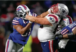  ?? Jeffrey T. Barnes / Associated Press ?? Along with a Dolphins loss, center David Andrews, right, and the Patriots can clinch the AFC East with a victory over Ed Oliver and the Bills. If the Bills win, they would hold tiebreaker­s.