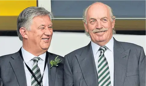  ??  ?? MEETING: Celtic chief executive Peter Lawwell, left, and major shareholde­r Dermot Desmond spoke with Neil Lennon.