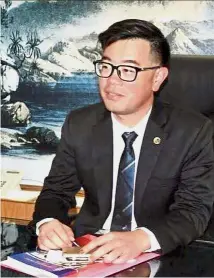  ??  ?? Young leader: Wong pictured during a media interview at the Agricultur­e and Food Industries Ministry office which he now helms.