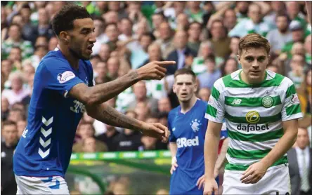  ??  ?? Connor Goldson was penalised by referee Willie Collum for a challenge on Ryan Christie in the final minutes at Celtic Park