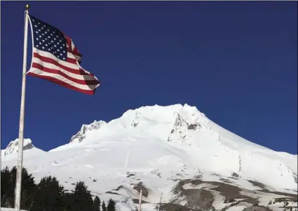  ?? AP PHOTO/GILLIAN FLACCUS ?? In this Feb. 13, file photo, Oregon’s Mount Hood is seen from Timberline Lodge on the south side of the mountain. The 2018 eruption of the Kilauea volcano in Hawaii has geologic experts along the West Coast warily eyeing the volcanic peaks in...