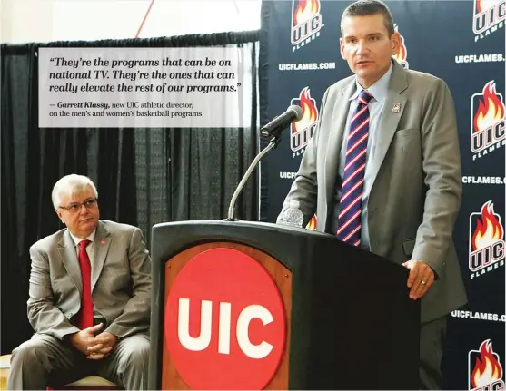  ?? | JENNY FONTAINE/ UIC ?? UIC athletic director Garrett Klassy ( right), with chancellor Michael Amiridis, came from George Washington, where he learned how to work in a competitiv­e market.