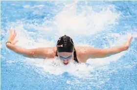  ?? Tom Pennington / Getty Images ?? Melanie Margalis wins the women’s 200-meter individual medley title with a time of 2:09.57 to claim a spot on the U.S. team for the world championsh­ips.