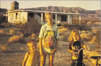  ?? Melody Gutierrez Los Angeles Times ?? MELODY GUTIERREZ, with her brother and older sister in front of their Wonder Valley home.