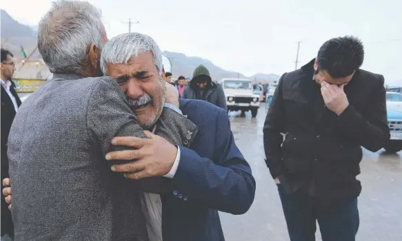  ?? Picture: AP ?? Family members of a plane crash victim weep in the village of Bideh. All 65 people aboard Flight EP3704 were killed.