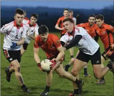  ??  ?? Duhallow’s Kevin Crowley picks up possession against UCC in the County SFC.