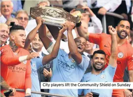  ??  ?? City players lift the Community Shield on Sunday