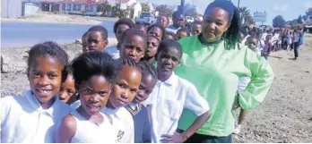  ?? Picture: ANDILE NXELE ?? KEEP ON WALKING: Mdantsane-based Nowonga Primary School pupils with their teacher Miss Mzamo on their recent Big Walk